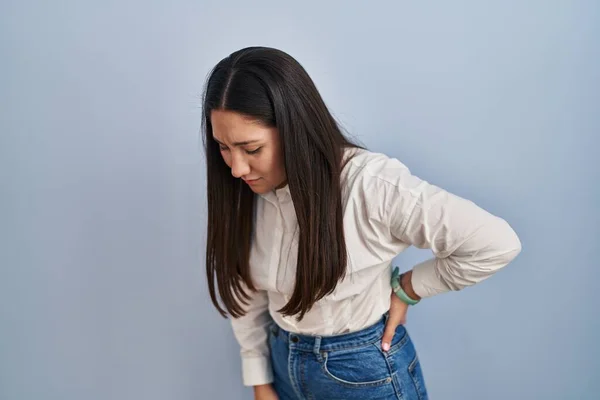 Young Latin Woman Standing Blue Background Suffering Backache Touching Back — Zdjęcie stockowe