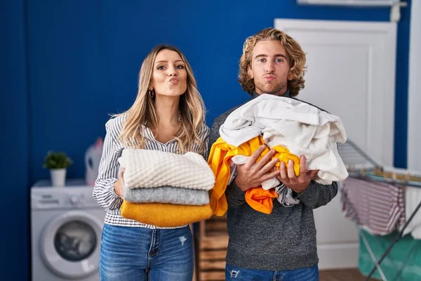 Young Couple Doing Laundry Looking Camera Blowing Kiss Being Lovely — Zdjęcie stockowe