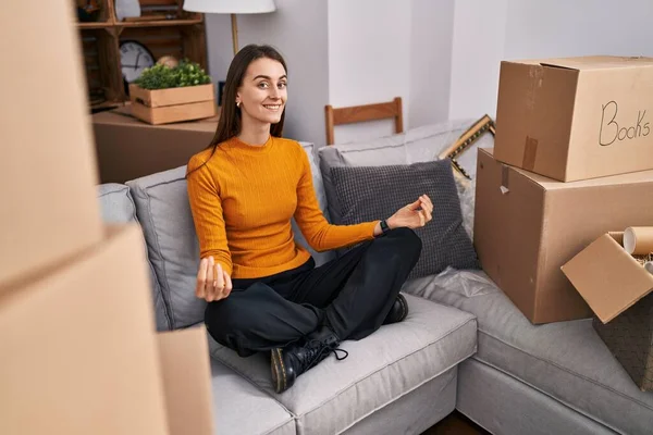 Young Caucasian Woman Doing Yoga Exercise Sitting Sofa New Home — Stock Photo, Image