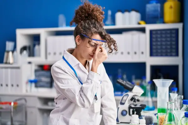 Young Hispanic Woman Scientist Stressed Working Laboratory — Stockfoto