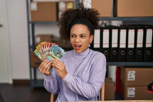 Young African American Woman Working Small Business Ecommerce Holding Australian — Stockfoto