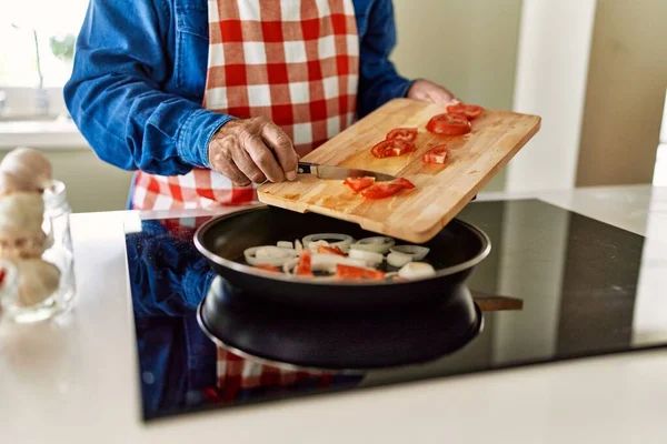 Senior Man Pouring Tomato Frying Pan Kitchen — Stock Photo, Image