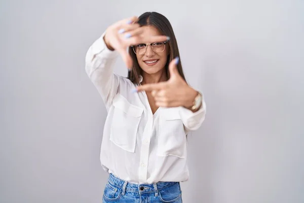 Young Brunette Woman Wearing Glasses Smiling Making Frame Hands Fingers — Zdjęcie stockowe