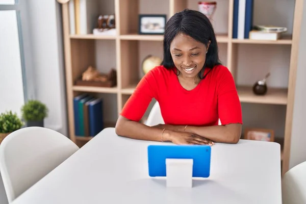 Young African American Woman Watching Video Sitting Table Home — Stockfoto