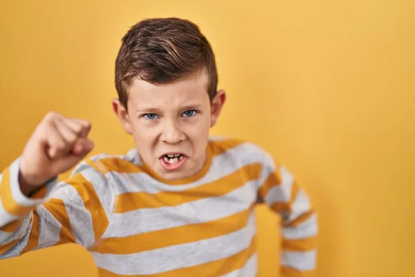 Young Caucasian Kid Standing Yellow Background Angry Mad Raising Fist — Stock Photo, Image