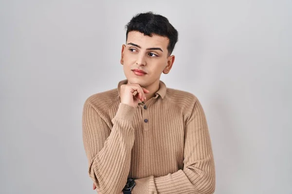 Non Binary Person Standing Isolated Background Hand Chin Thinking Question — Foto de Stock