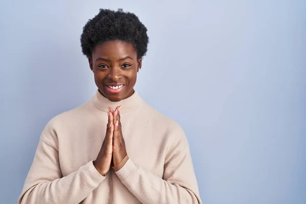 African American Woman Standing Blue Background Praying Hands Together Asking — Stockfoto