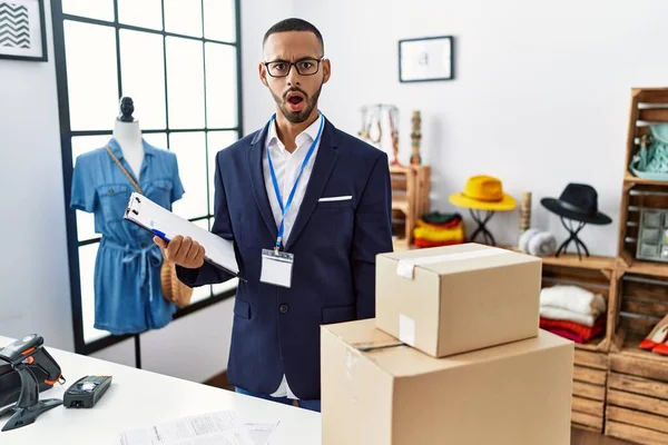 African American Man Working Manager Retail Boutique Shock Face Looking — Stock Photo, Image