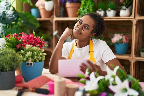 African American Woman Florist Smiling Confident Reading Document Flower Shop — Stock Photo, Image