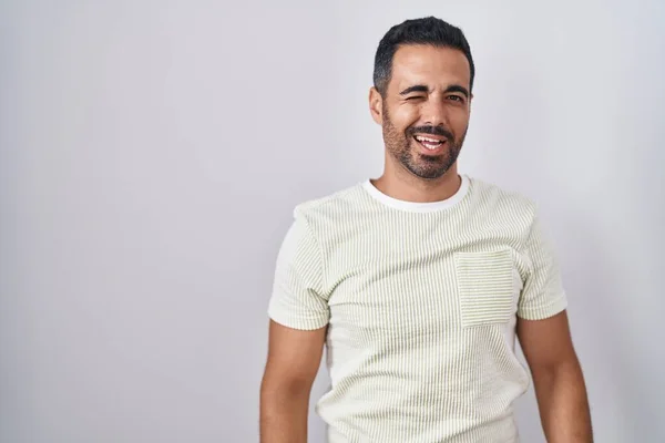 Hispanic Man Beard Standing Isolated Background Winking Looking Camera Sexy —  Fotos de Stock