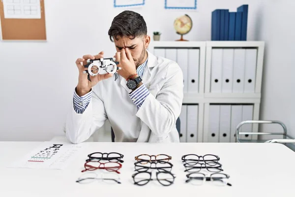 Young Optician Man Holding Optometry Glasses Tired Rubbing Nose Eyes — 图库照片