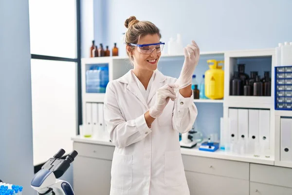 Young Blonde Woman Wearing Scientist Uniform Gloves Laboratory — стоковое фото
