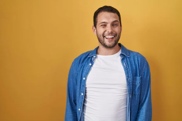 Hispanic Man Standing Yellow Background Winking Looking Camera Sexy Expression — Stock Photo, Image