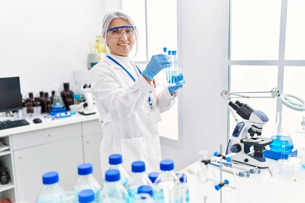 Middle Age Grey Haired Woman Wearing Scientist Uniform Using Laptop — Stock Photo, Image
