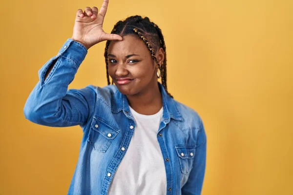 African American Woman Braids Standing Yellow Background Making Fun People —  Fotos de Stock