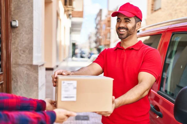 Young Hispanic Man Courier Giving Package Street — Stock Fotó