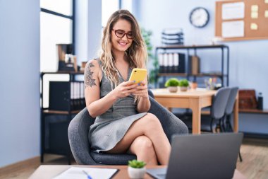 Young woman business worker using smartphone at office