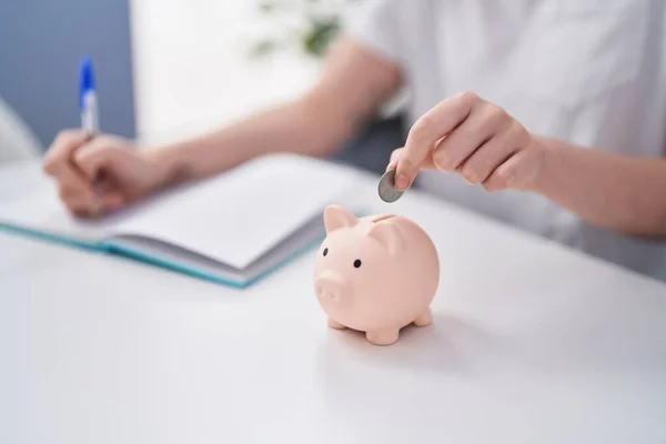 Young Woman Writing Notebook Inserting Coin Piggy Bank Home — Stock Photo, Image