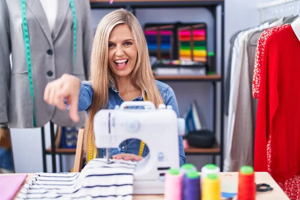 Blonde Woman Dressmaker Designer Using Sew Machine Pointing You Camera — Stock fotografie