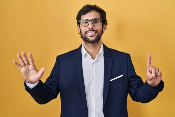 Handsome Latin Man Standing Yellow Background Showing Pointing Fingers Number — Stockfoto
