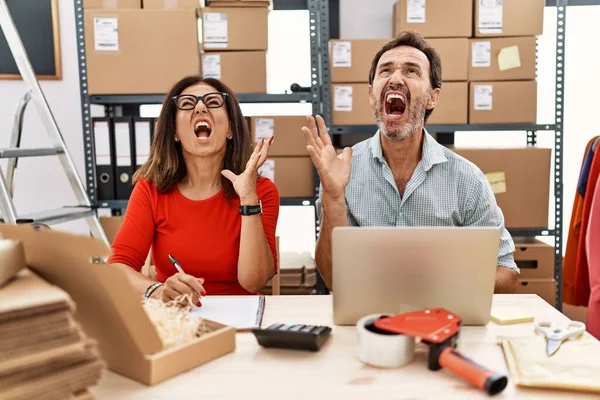 Middle Age Couple Working Small Business Ecommerce Crazy Mad Shouting — Stock Photo, Image