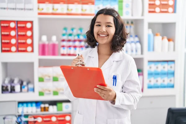 Young Woman Pharmacist Writing Document Pharmacy — Foto de Stock