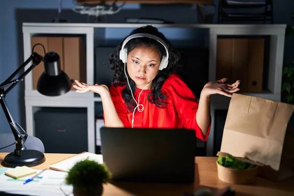 Young Asian Woman Working Office Laptop Night Clueless Confused Expression —  Fotos de Stock