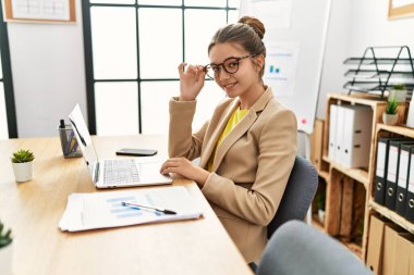 Adorable girl business worker using laptop working at office