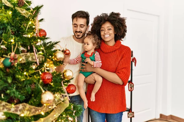 Couple Daughter Smiling Confident Decorating Christmas Tree Home — 图库照片