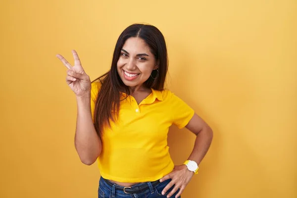 Young Arab Woman Standing Yellow Background Smiling Looking Camera Showing — Zdjęcie stockowe