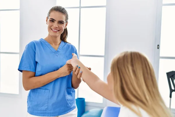 Woman Girl Physiotherapist Patient Having Rehab Session Stretching Hand Physiotherapy — Stockfoto