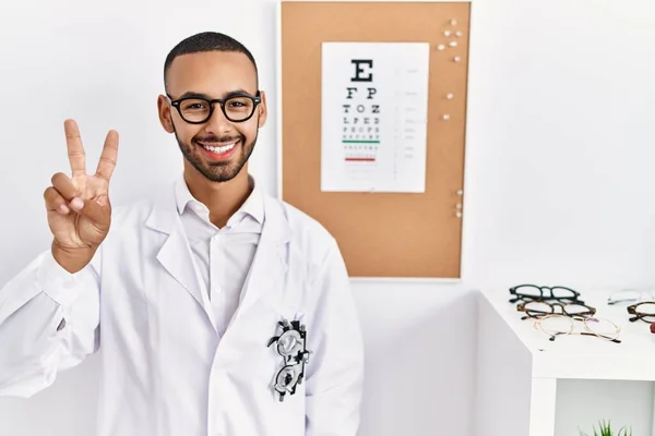 African American Optician Man Standing Eyesight Test Showing Pointing Fingers — Stockfoto