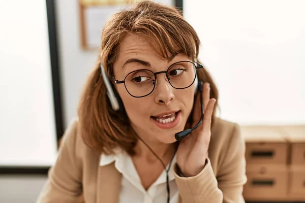 Young caucasian call center agent woman smiling happy working at the office.