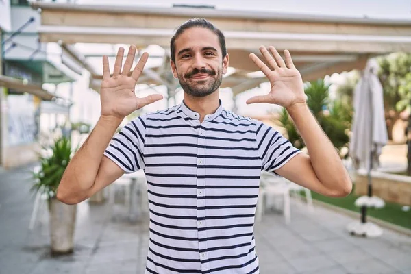 Young Hispanic Man Beard Outdoors City Showing Pointing Fingers Number — Stock Photo, Image