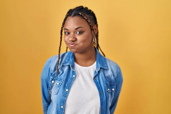 African American Woman Braids Standing Yellow Background Puffing Cheeks Funny —  Fotos de Stock