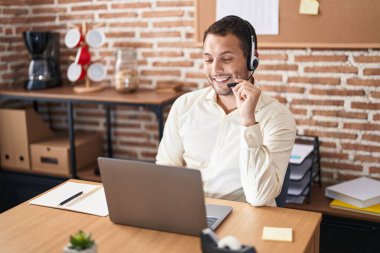 Young man call center agent having video call at office