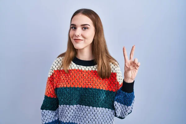 Young Hispanic Girl Standing Blue Background Showing Pointing Fingers Number — Fotografia de Stock