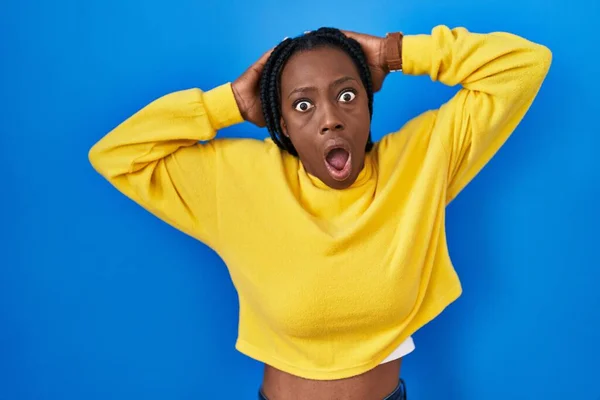 Beautiful Black Woman Standing Blue Background Crazy Scared Hands Head — Stockfoto