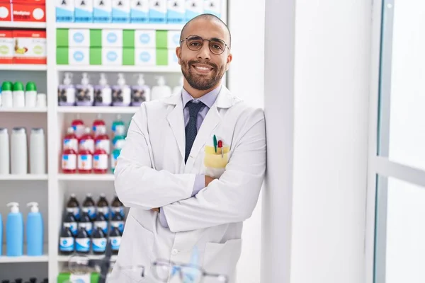 Young Latin Man Pharmacist Smiling Confident Standing Arms Crossed Gesture — Zdjęcie stockowe