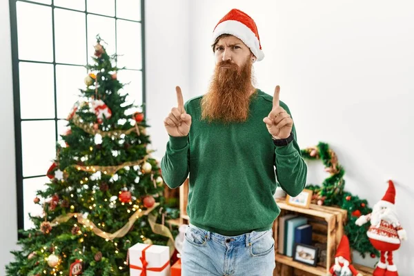 Redhead Man Long Beard Wearing Christmas Hat Christmas Tree Pointing — Stock Photo, Image