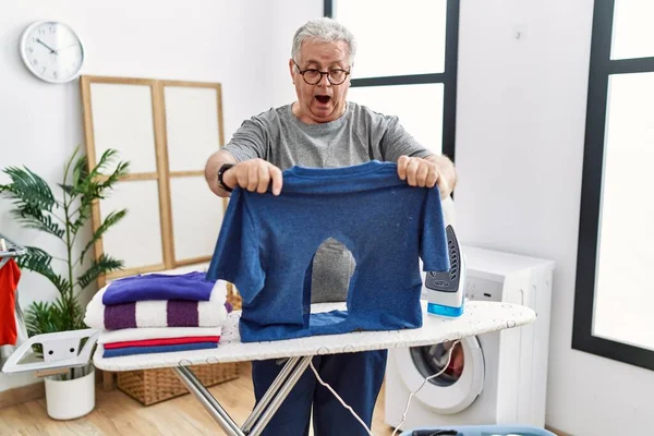 Senior Caucasian Man Ironing Holding Burned Iron Shirt Laundry Room — Stock Photo, Image