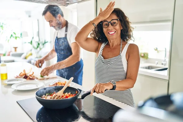 Middle Age Couple Cooking Mediterranean Food Home Stressed Frustrated Hand — Stock Photo, Image