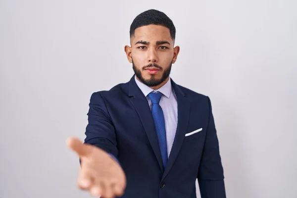 Young Hispanic Man Wearing Business Suit Tie Smiling Cheerful Offering — Stockfoto