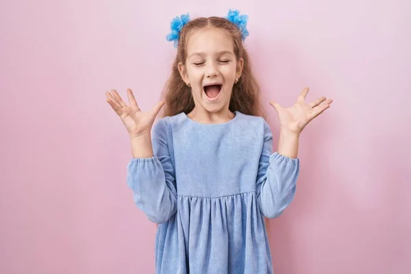 Young Little Girl Standing Pink Background Celebrating Mad Crazy Success — Stockfoto