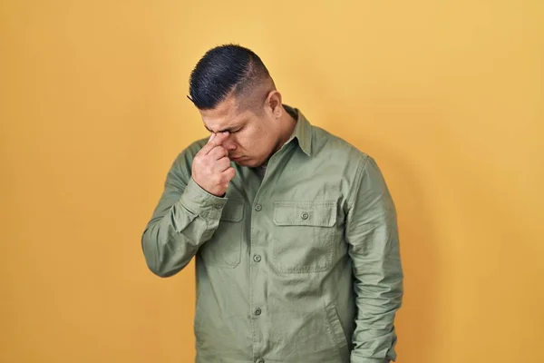 Hispanic Young Man Standing Yellow Background Tired Rubbing Nose Eyes — Stock Photo, Image
