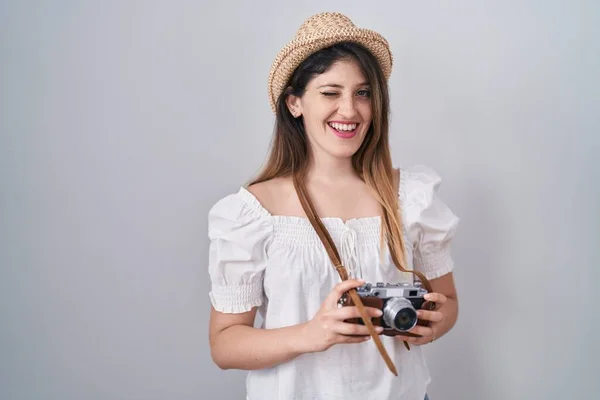 Young Brunette Woman Holding Vintage Camera Winking Looking Camera Sexy — Stock fotografie