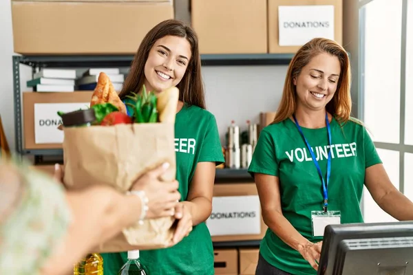 Mother Daughter Wearing Volunteer Uniform Holding Groceries Paper Bag Charity — Stock Photo, Image