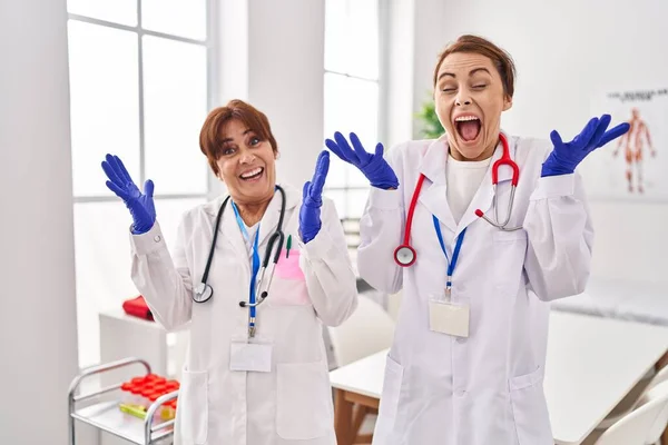 Two Women Wearing Doctor Uniform Stethoscope Celebrating Mad Crazy Success —  Fotos de Stock