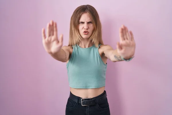 Blonde Caucasian Woman Standing Pink Background Doing Stop Gesture Hands — Foto de Stock