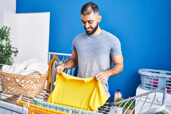 Young Hispanic Man Smiling Confident Hanging Clothes Clothesline Laundry Room — Stock Photo, Image